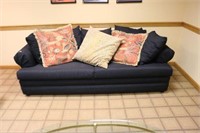 Two Black Upholstered Sofas and Decorative