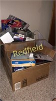 Box lot of mostly unopened electronics and more.