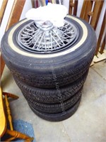 4 wive spoke rims w/ 251-65-R15 tires AS IS