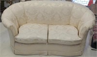 Quality cream fabric upholstered two seater sofa