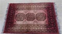 Vintage red ground wool Persian rug