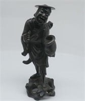 Chinese carved wood figure of man carrying