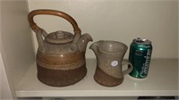 Tea pot and cream pitcher.