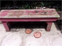 Red wooden outdoor bench
