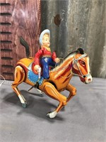 Horse w/ rider wind-up tin toy