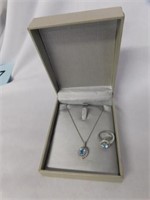 Silver and aquamarine ring and matching necklace,