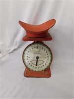 American Family vintage scale with weighing