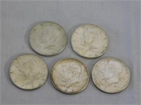 Five 1964 silver Kennedy halves