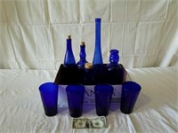 Blue glass bottles and glasses