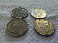 3 peace silver dollars and 1 Morgan silver dollar