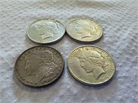 3 peace silver dollars and one Morgan silver