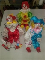 Three large clowns