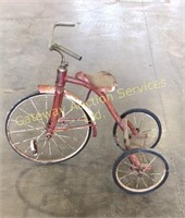 Antique kids trike standing about 30 inches tall
