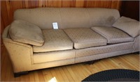 Sofa with decorated wooden feet