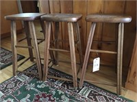 three small bar stools
