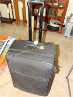 Tumi - large suitcase 25"H x 19" W
