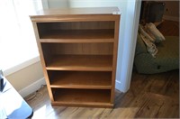 Four shelf maple colored book shelf