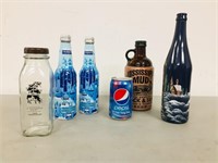 collection of bottles including Vietnam pepsi