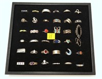 36- Sterling silver rings, including a black and