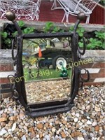 Old country mirror with hames and horse shoes;