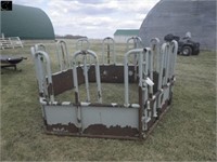 Tombstone-style bale feeder