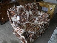 Older upholstered love seat