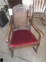 Antique wood and upholstered rocking chair