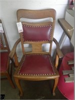 Antique wood and upholstered armchair