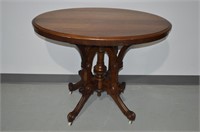 Victorian Oval Parlor Table On Porcelain Wheels