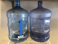 Two Five Gallon Plastic Water Jugs