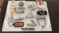 Assorted pocket knives, keychains and other items