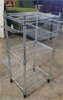 Wire shelving rack with drawer and movable holder