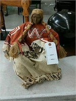 Native figurine with braided hair