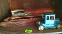 Antique sewing spools and model cars
