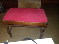 Wooden bench with red seat