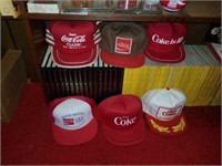 Lot of coca cola hats