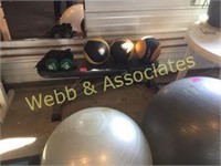 exercise balls and two weights and bench