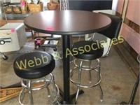 high top table and two stools