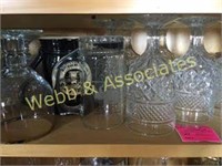 Contents of top shelf: glasses, pitcher, mug