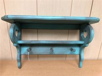 24in Teal painted wood shelf with pegs