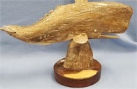 10" carved bone whale mounted on wood base, by Mic