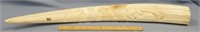 Bull walrus tusk, 28" long with relief carvings of