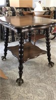 Claw foot serving table with metal feet and glass
