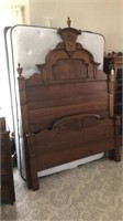 Full size bed with headboard and footboard