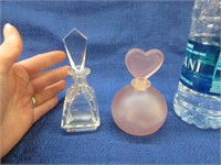 2 perfume bottles (clear & pink)