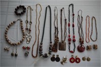 Assorted earth tone and red beaded necklaces,
