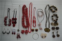 Assorted earth tone and red beaded necklaces,