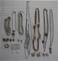 Assorted silver and gold tone beads, necklaces,