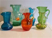 Stretch glass pitchers, 6, tallest is 6 inches