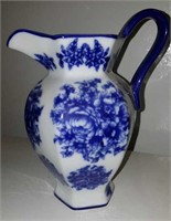 Blue and white milk pitcher by Basic Porcelana